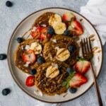 Gluten free Sweet Potato Pancakes | This gluten free pancake recipe will give your family breakfast game a healthy twist! It is paleo, gluten free, sugar free, dairy free and super easy to make. Only made with simple ingredients like sweet potato, banana and eggs. It's the perfect healthy breakfast or brunch to share with your family! | #shuangyskitchensink #paleo #glutenfree #pancakerecipe #paleobreakfast #glutenfreepancakes #sweetpotato #paleorecipes #healthybreakfast