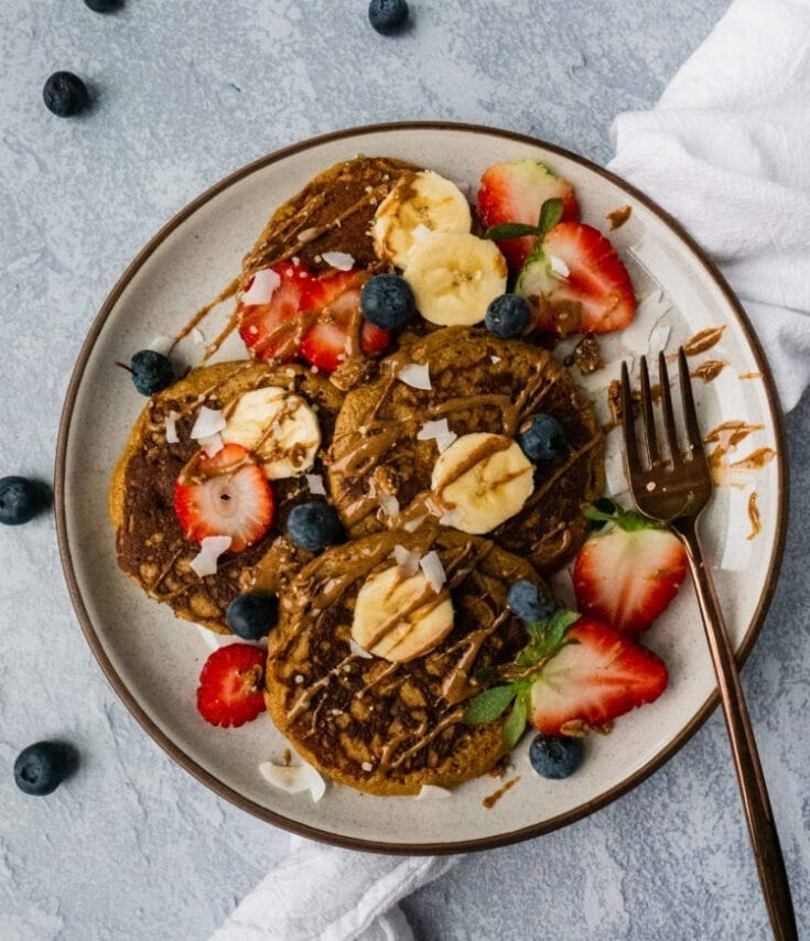 Gluten free Sweet Potato Pancakes | This gluten free pancake recipe will give your family breakfast game a healthy twist! It is paleo, gluten free, sugar free, dairy free and super easy to make. Only made with simple ingredients like sweet potato, banana and eggs. It's the perfect healthy breakfast or brunch to share with your family! | #shuangyskitchensink #paleo #glutenfree #pancakerecipe #paleobreakfast #glutenfreepancakes #sweetpotato #paleorecipes #healthybreakfast
