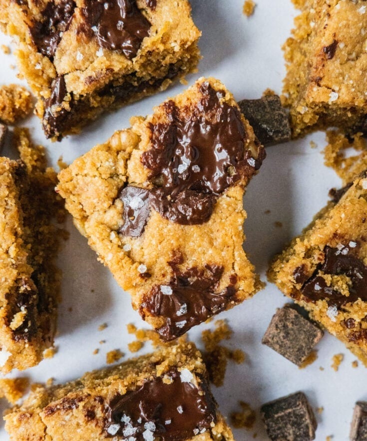 Chocolate Chip Blondies (Cookie Bars) | These healthy Chocolate Chip Blondie Bars are the best gluten free, dairy free, paleo dessert that are so easy to make. Crispy edges, gooey and buttery inside, topped off with dark chocolate chunks and flaky sea salt, these chocolate blondies are just the best paleo gluten free dessert for the whole family. |#healthydessert #chocolatechip #cookierecipe #paleodessert #glutenfreedessert #healthyrecipe #easydessert