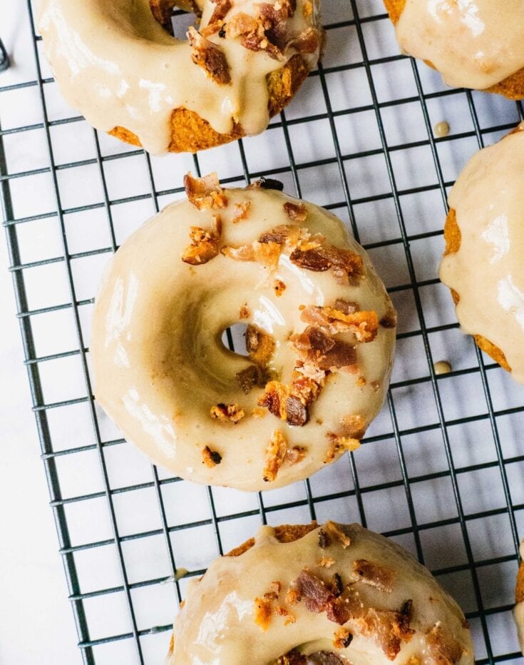 maple bacon donuts on a cooling rack