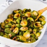 Oven baked Crispy Bacon Brussel Sprouts | These oven roasted crispy bacon brussels sprouts are so delicious and flavorful. They are also incredibly easy to make under 20 minutes. Even better? This healthy recipe is paleo and whole 30 compliant. Perfect Thanksgiving or Christmas Side dish that are tasty and healthy. | #thanksgiving #brusselsprouts #bacon #whole30 #paleo #lowcarb #glutenfree #healthyrecipe