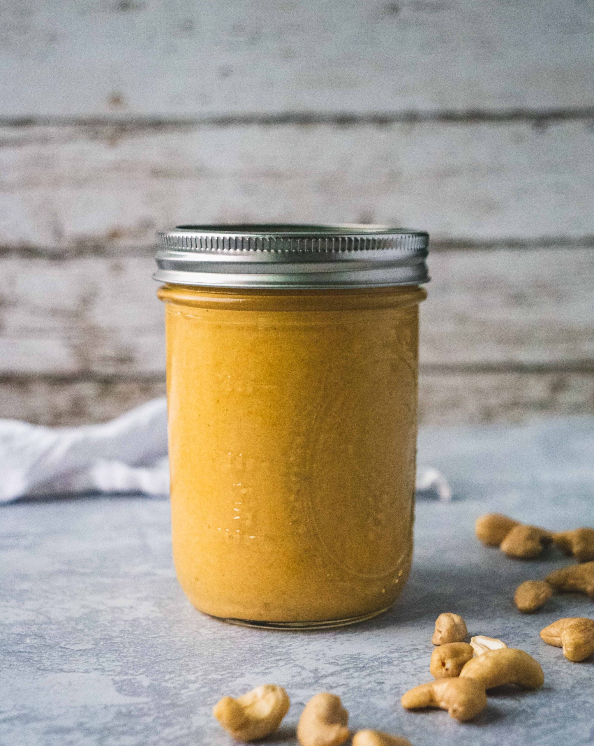 a jar of homemade butternut squash cashew vegan cheese sauce