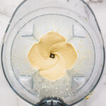 Freshly blended cashew cream cheese frosting. The texture seems to be creamy and siky.