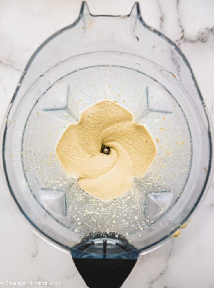 Freshly blended cashew cream cheese frosting. The texture seems to be creamy and siky.