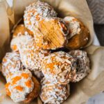 A batch of no bake paleo carrot cake energy balls that are smooth and fudgy on the inside. Taste just like carrot cake truffles. They make the perfect vegan energy bites.