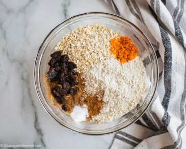 A bowl of carrot cake Oatmeal Cookie ingredients: Oats, grated carrots, raisins.