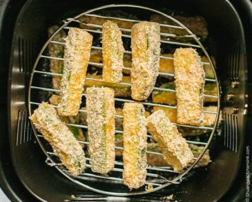 Basket of zucchini fries before frying in the air fryer.