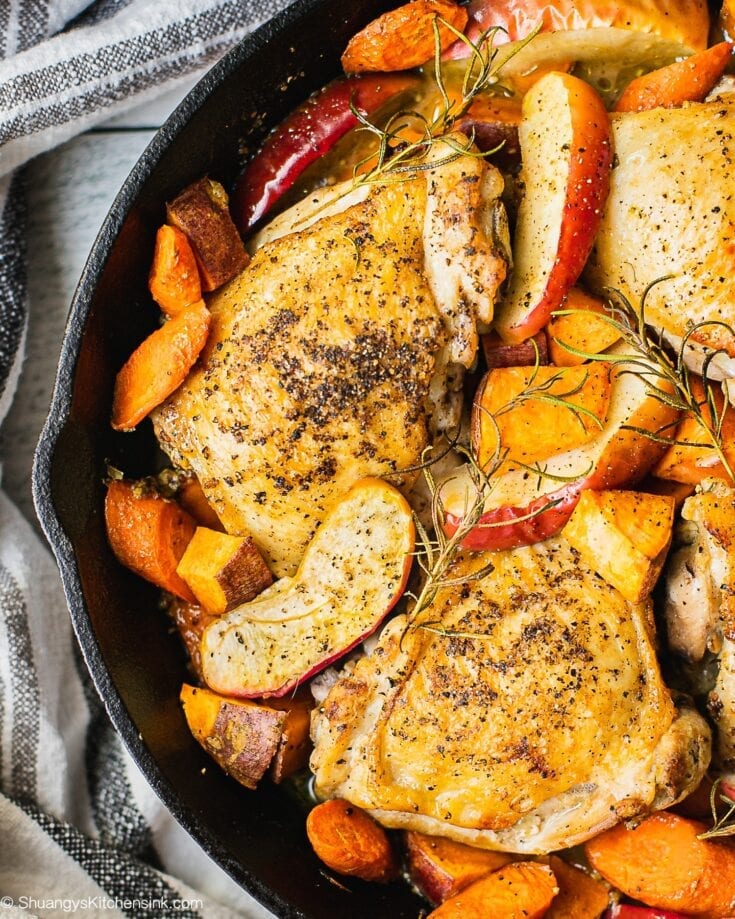 One pan Chicken thighs seared to crispy brown. Topped with cooked apples, carrots, sweet potatoes and fall vegetables.