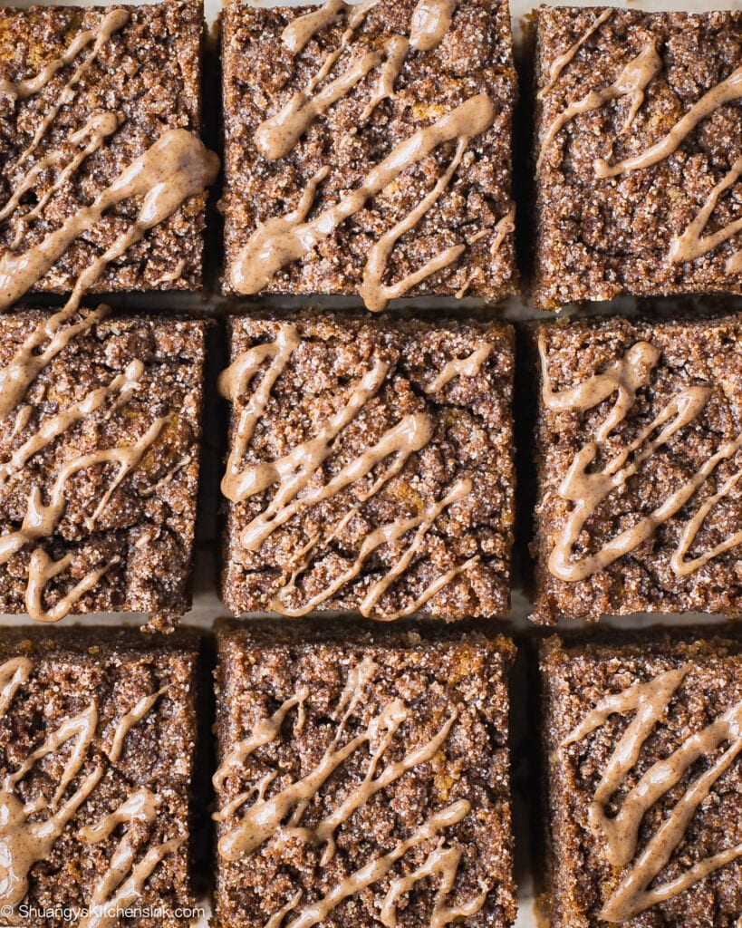 A batch of freshly baked paleo coffee cake topped with cinnamon crumble toppings and almond butter.