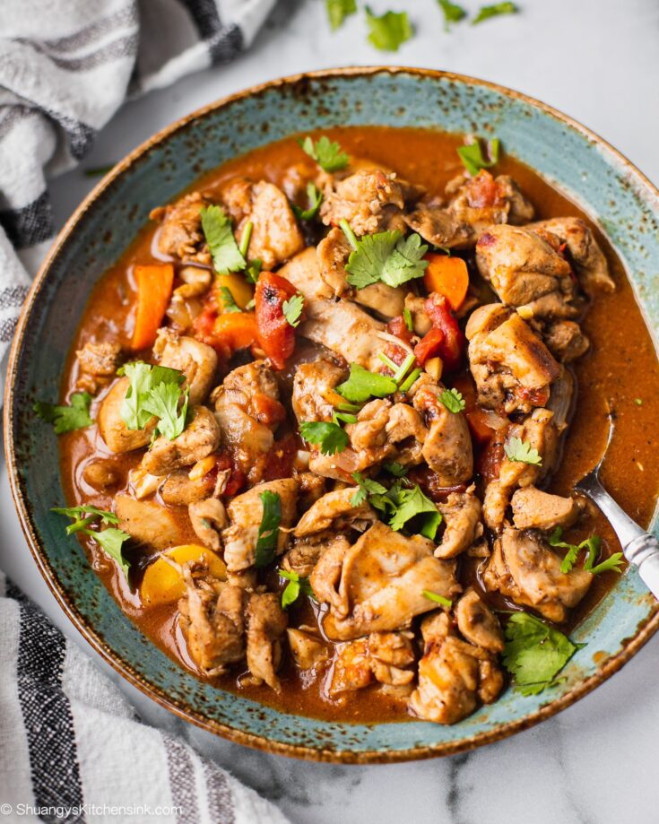 A plate of keto butter chicken that is cooked in flavorful Indian Spiced sauce in the instant pot. It has cilantro on top for garnish.