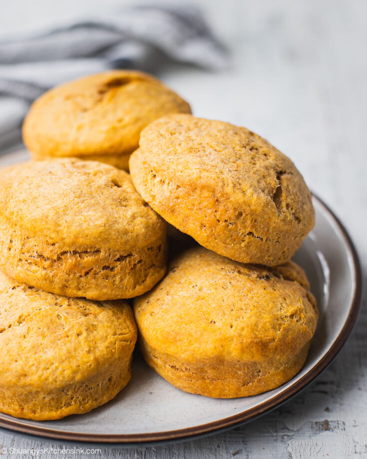 A plate of sweet potato vegan biscuits that appears to be soft, fluffy and delicious.