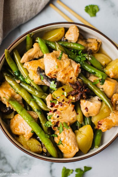 A bowl of Chicken Green beans potatoes that is my favorite homemade authentic and healthy Chinese food.