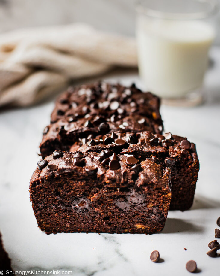 Five slices of gluten-free banana bread full of dark chocolate