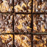 nine squared of healthy banana brownies shot from above. The gluten free chocolate dessert is swirled with nut butter