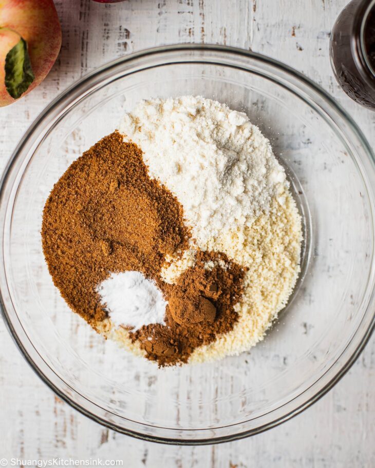 Instruction to make apple butter cookies: In a mixing bowl, add almond flour, coconut flour, coconut sugar, apple pie spice, and baking soda.