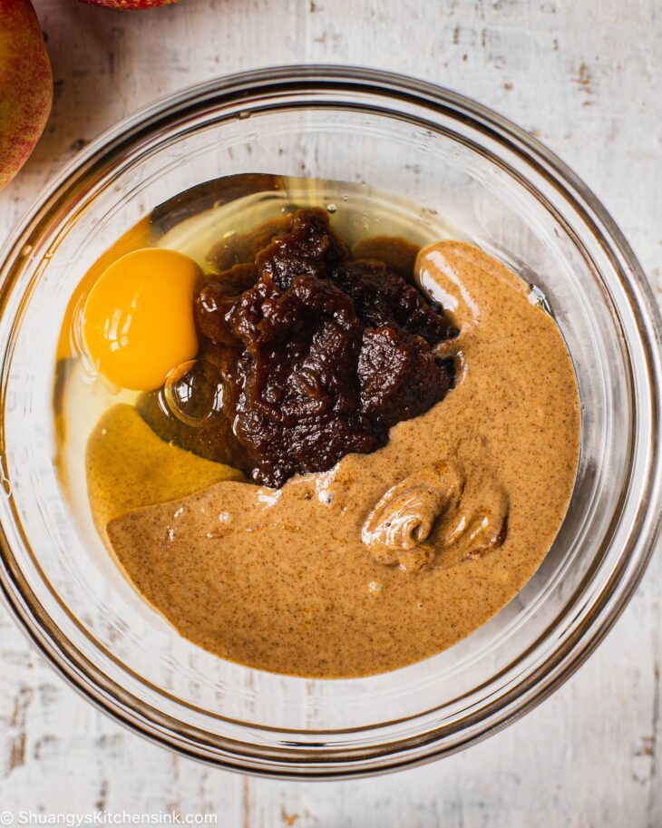 Instruction to make apple butter cookies: In a separate bowl, add in the egg, almond butter, and apple butter.