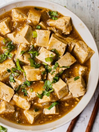 A bowl of Authentic Chinese Sticky tofu in a fragrant vegan stir-fry sauce