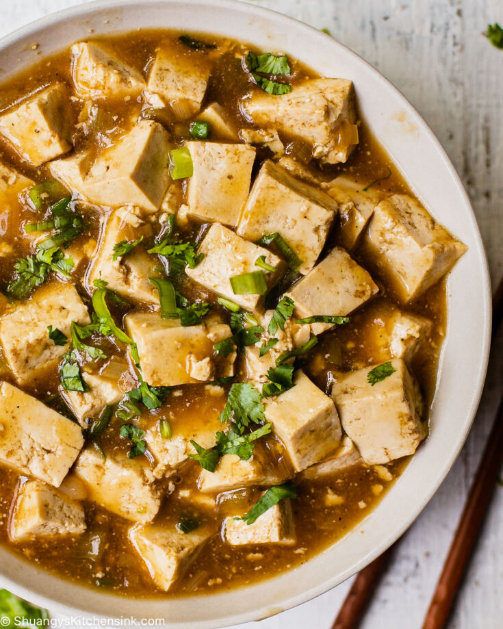A bowl of Authentic Chinese Sticky tofu in a fragrant vegan stir-fry sauce