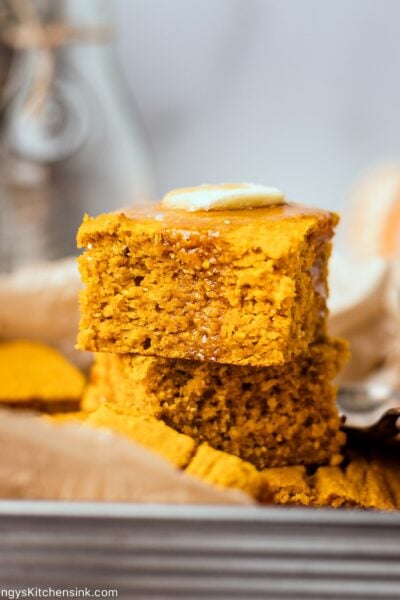 moist and fluffy gluten-free pumpkin cornbread topped with vegan butter