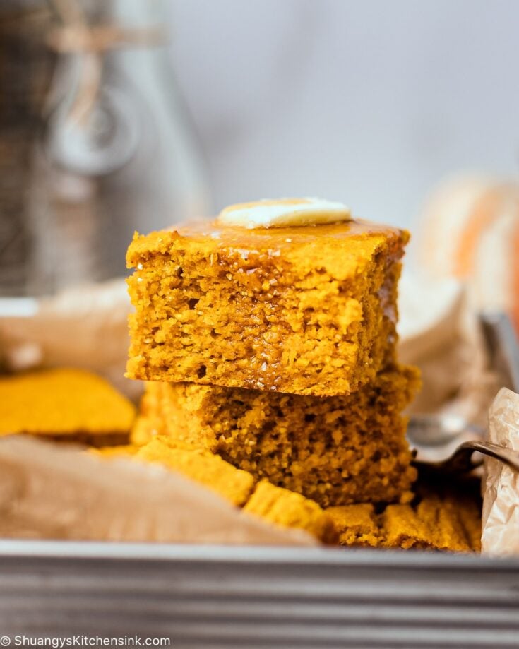 moist and fluffy gluten-free pumpkin cornbread topped with vegan butter