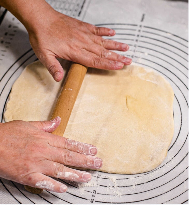 Using a rolling pin, roll the dough into a thin rectangle.