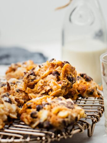 healthy keto magic cookies on a tray. You can see pieces of chocolate and nuts in the cookies
