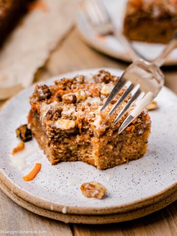 fork digging into delicious carrot coffee cake