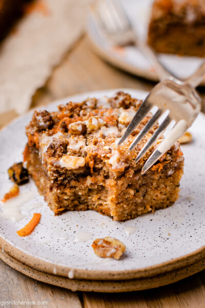 fork digging into delicious carrot coffee cake