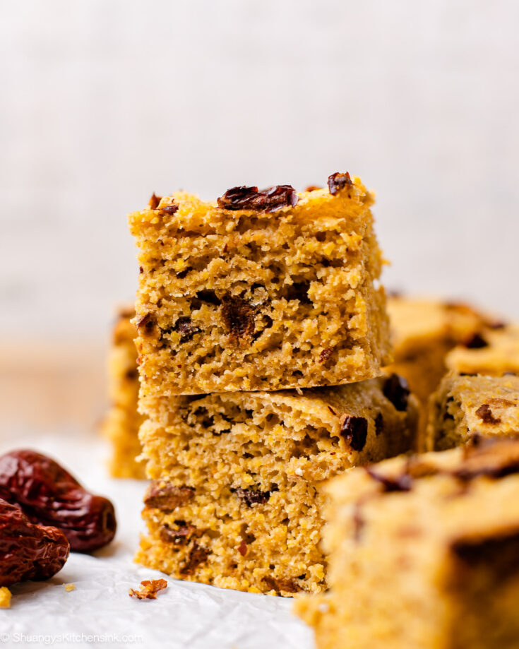 Jujube dates are filled in the delicious corn flour sponge cake which is stacked on parchment paper