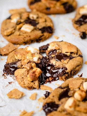 Ooey gooey s'mores cookie on a line parchment tray