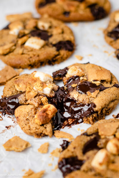 Ooey gooey s'mores cookie on a line parchment tray