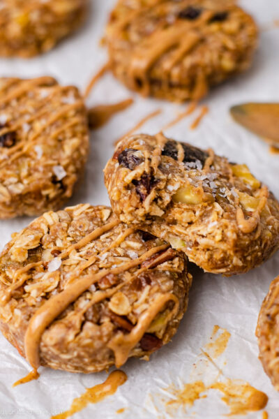 A stack of no bake morning glory muffins is sitting on parchment paper