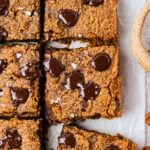 This image is showing a the ooey gooey pumpkin blondies with melty chocolate on top