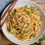 Asian Noodle Salad is served on a small plate and topped with cilantro