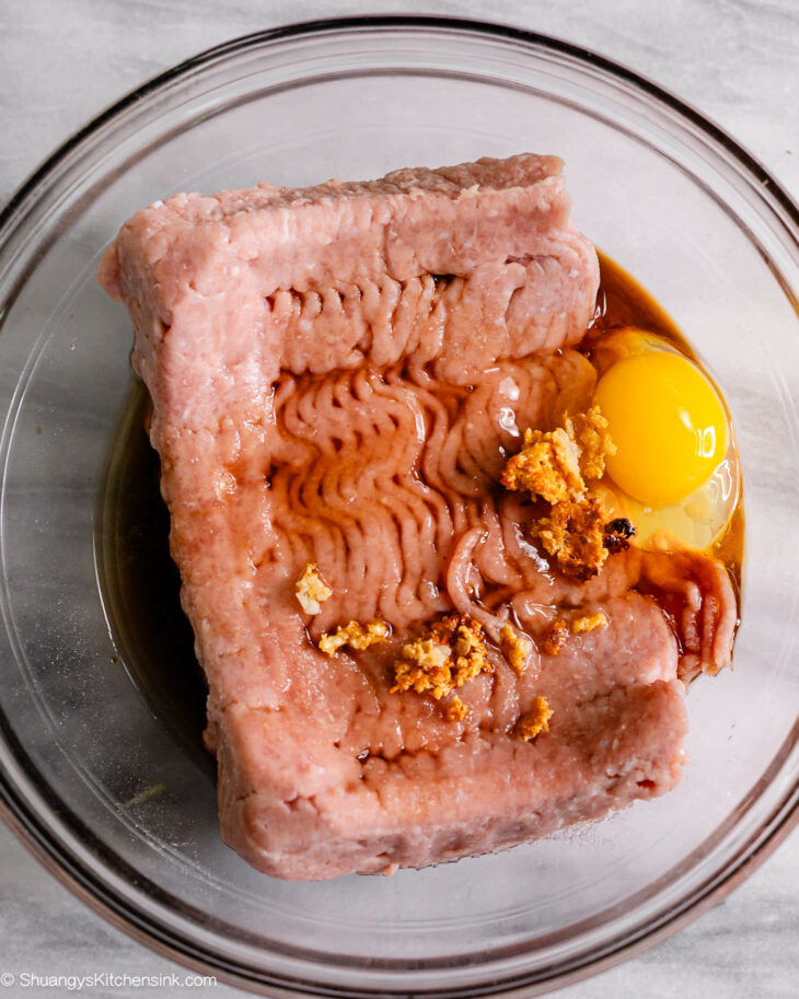 Step by step instruction for honey garlic meatballs - Combine the ground chicken, egg, sautted garlic, coconut aminos and honey in a big bowl. Gently mix.