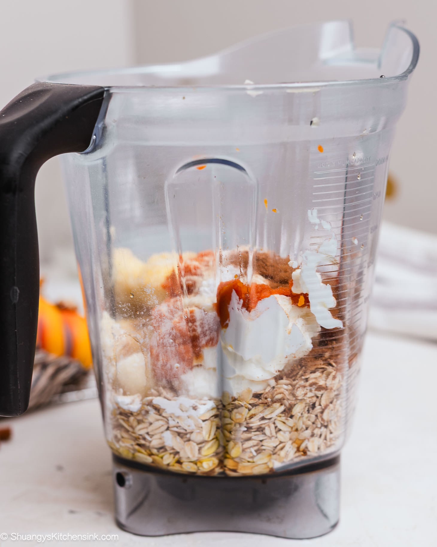 A blender with all the ingredients for pancake oat bake.