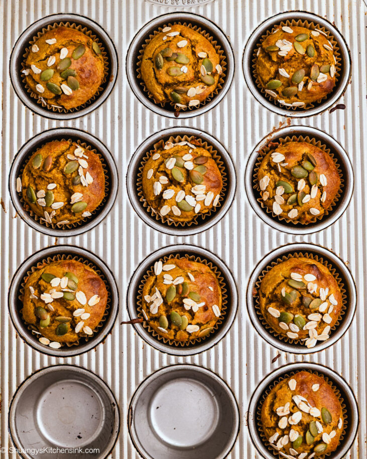 Muffin tin filled with freshly baked pumpkin oat muffins
