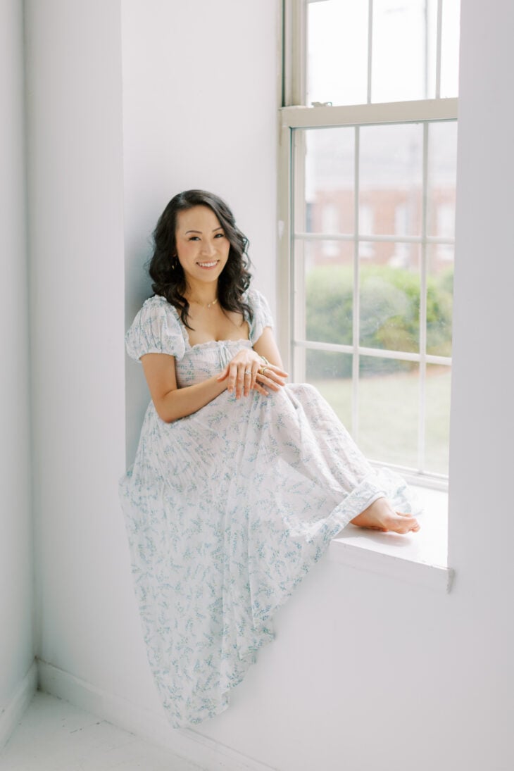 Shuang Shuang Liang, the recipe developer behind Shuangy's Kitchensink, sitting in a sunny window