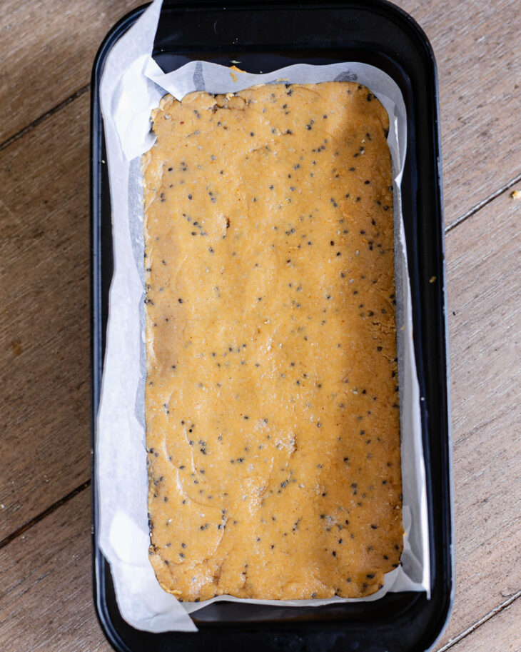 step by step instruction on making copycat perfect bar -Press into a parchment paper lined 8x4 loaf pan. Chill.