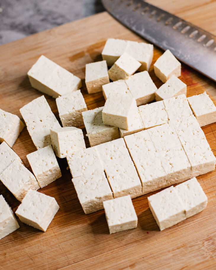 Instruction on how to make sweet and sour tofu - Cut the tofu in even sized cubes.