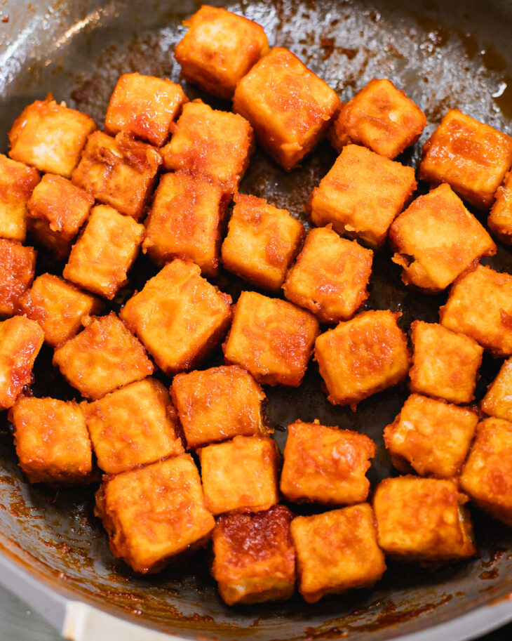 Instruction on how to make sweet and sour tofu - Until all the tofu cubes are evenly coated in the sauce.