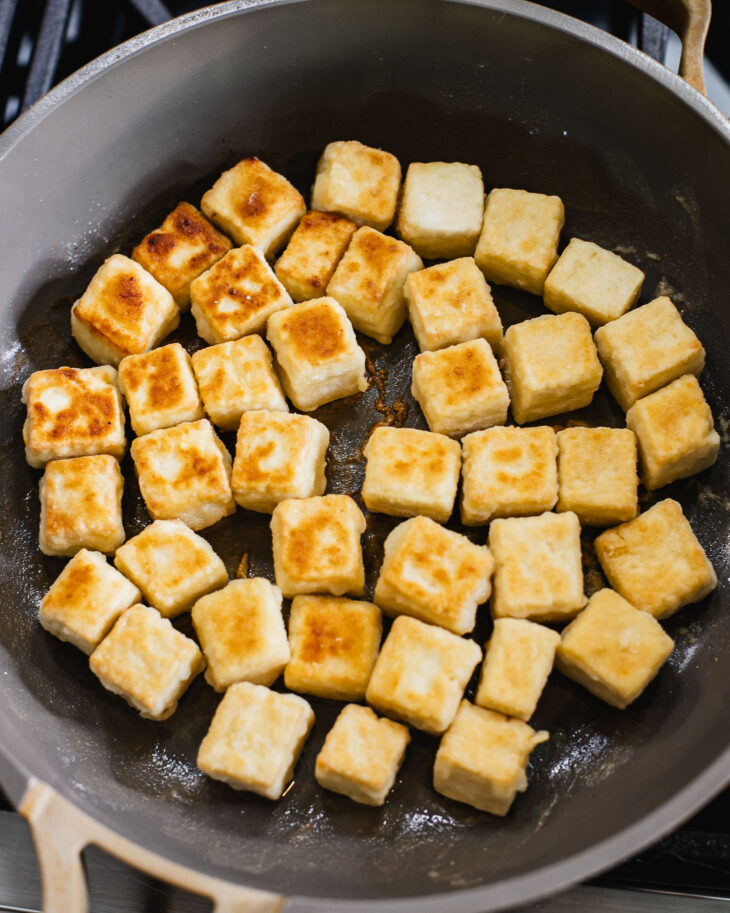 Instruction on how to make sweet and sour tofu - Pan sear until all sides of the tofu are crispy golden brown.