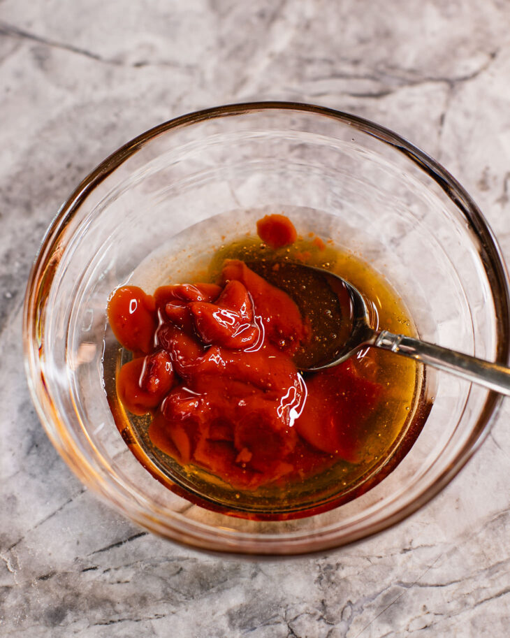 Instruction on how to make sweet and sour tofu - In a bowl, add ketchupl honey and rice vinegar.