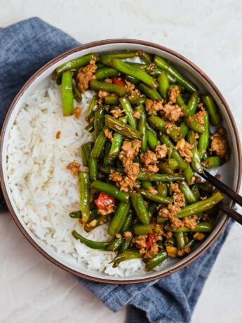 Green beans and pork stir fry with minced pork served over white rice, easy weeknight meal