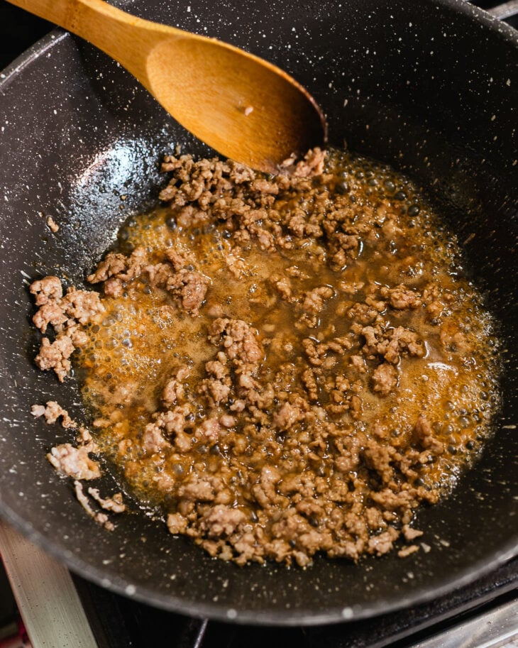 Break the pork apart as it cooks, stirring until it’s almost fully done.