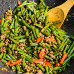 Green beans and pork stir fry with minced pork, cooked in a wok with garlic and sauce