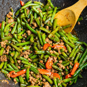 Green beans and pork stir fry with minced pork, cooked in a wok with garlic and sauce