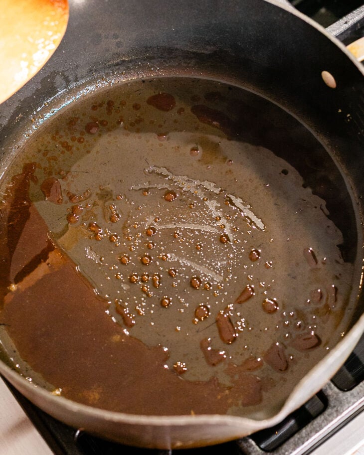 Over medium heat, let it melt, then gently stir a few times until it turns an amber color.