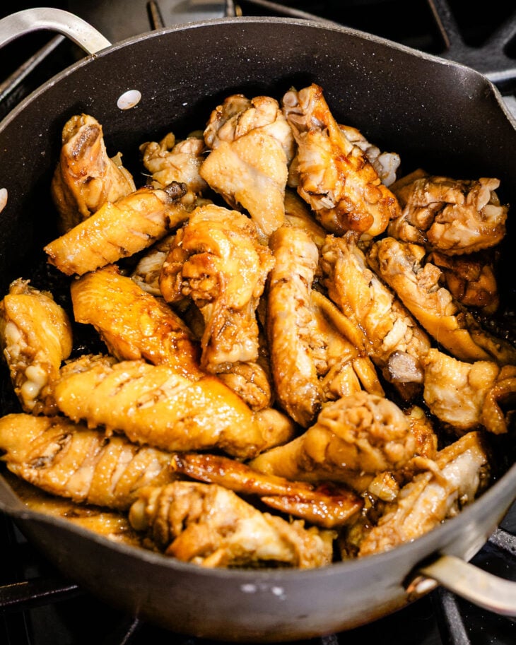 Drain the marinade and add the chicken wings to the pot.