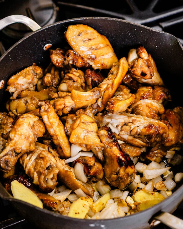 Stir in the ginger, garlic, and onion.